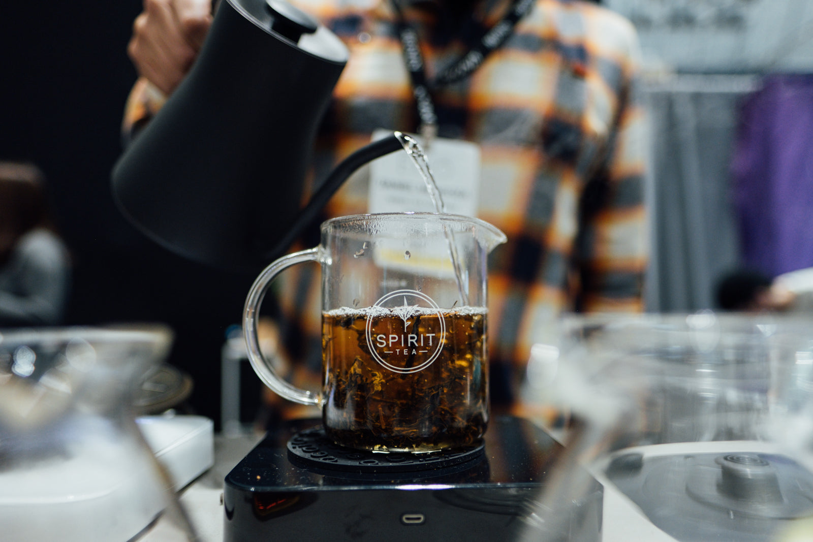 A carafe imprinted with Spirit Tea brewing on a Pearl scale